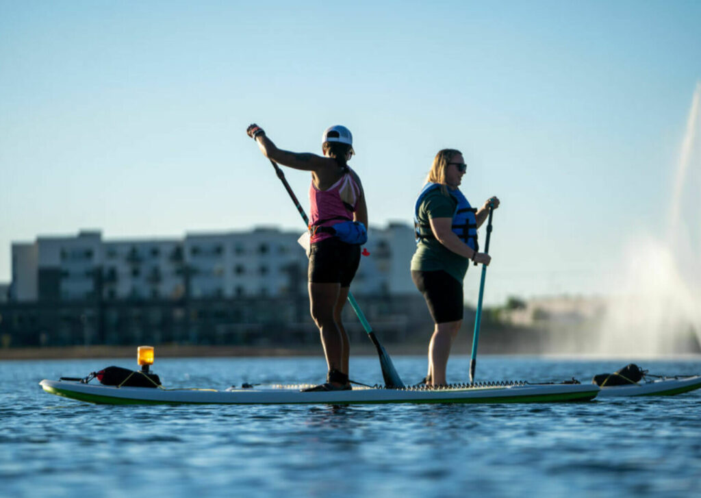 Two people paddleboarding on Lake Lorraine